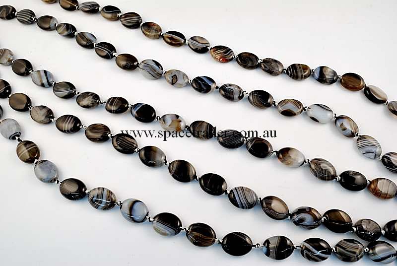 Agate - 12x16mm Puffed Oval Black Banded Agate in 22 Pcs a Strand